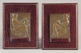 A. GUZMAN (1904 - 1943). ART DECO BRONZE MEDALS mounted on a leather nude Egyptian lady. Signed, 2.