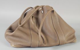 A HERMES SOFT COFFEE COLOURED HAND BAG. 40cm long, 24cm high incl. a Hermes dust bag.