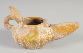 AN 8TH-9TH CENTURY UMAYYAD YELLOW GLAZED POTTERY OIL LAMP, 13.5cm spout to handle.