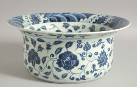 A CHINESE BLUE AND WHITE PORCELAIN WASH BOWL, with floral decoration and wave pattern rim, 32cm