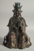 A CHINESE BRONZE BUDDHA, with traces of gilt and paint, 29.5cm high.