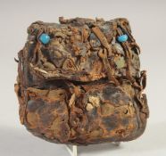 AN ANTIQUE ASIAN LEATHER POUCH.