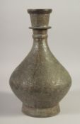 AN ISLAMIC TINNED COPPER VASE, 32cm high.
