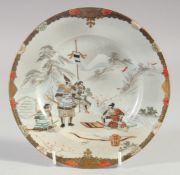 A JAPANESE KUTANI PORCELAIN DISH, painted with warriors, signed, 18.5cm diameter.