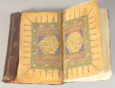 A 19TH CENTURY OTTOMAN LEATHER BOUND QURAN, 19cm x 12cm.