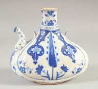 A TURKISH BLUE AND WHITE GLAZED POTTERY JUG, 18cm wide.