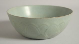 A CHINESE CELADON BOWL, with relief petal decoration to the exterior and moulded deer to the