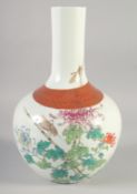 A CHINESE FAMILLE ROSE PORCELAIN VASE, painted with flora and insects with a coral red and gilt