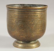 AN ISLAMIC ENGRAVED AND CHASED BRASS JARDINIERE, decorated with animals and foliage, 20cm high.