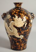A CHINESE JIZHOU POTTERY DRAGON VASE, with molded twin handles, 29.5cm high.