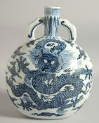 A CHINESE BLUE AND WHITE PORCELAIN TWIN HANDLE MOON FLASK, decorated with large dragon and bearing