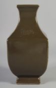 A CHINESE TEA DUST GLAZE SQUARE FORM VASE, character mark to base, 23.5cm high.