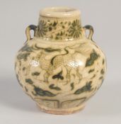 A THAI GLAZED POTTERY VASE, painted with beasts, 13.5cm high.