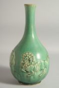 A CHINESE GREEN JIZHOU POTTERY VASE, with relief lions, 31.5cm high.