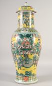A LARGE CHINESE YELLOW GROUND FAMILLE VERTE PORCELAIN VASE AND COVER, painted with a dignitary