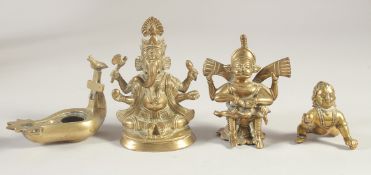 THREE BRASS FIGURES, together with a brass oil lamp, (4).