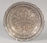A FINE ISLAMIC SILVER INLAID DISH, with engraved decoration and calligraphic inscriptions, 28cm