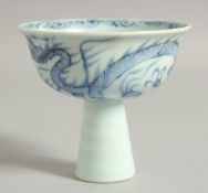 A CHINESE BLUE AND WHITE PORCELAIN STEM CUP, the exterior with dragon, cup 9.5cm diameter.
