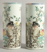 A PAIR OF CHINESE REPUBLIC POLYCHROME CYLINDRICAL VASES, decorated with a bird and flora, with