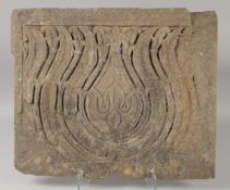 A FINE 17TH CENTURY MUGHAL NORTH INDIAN CARVED STONE PANEL, depicting a lotus flower, 48.5cm x