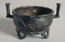 A CHINESE BRONZE TRIPOD CENSER, weighing 440gm, with bamboo form feet and handles, the base cast