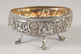 AN EMBOSSED AND CHASED SILVER OVAL FORM BOWL, decorated with panels of animals and flora, raised