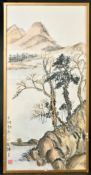 A CHINESE PAINTING OF A LANDSCAPE WITH MOUNTAINS, with calligraphy and red seal, framed and