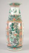 A LARGE CHINESE FAMILLE VERTE POLYCHROME VASE, with molded foo dog handles and chilong, painted with