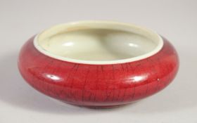 A CHINESE QING DYNASTY SANG DE BOEUF PORCELAIN BRUSH WASHER, six-character mark to base, 13cm