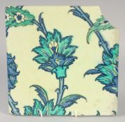 A FINE AND LARGE 16TH-17TH CENTURY OTTOMAN IZNIK OR DAMASCUS TILE, with floral decoration, 25cm