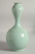 AN UNUSUAL CHINESE CELADON VASE, 30.5cm high.