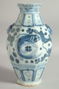 A CHINESE BLUE AND WHITE OCTAGONAL VASE, painted with fish and algae, the vase with molded twin