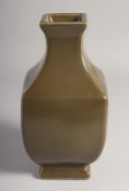 A CHINESE TEA DUST GLAZE SQUARE FORM VASE, six-character mark to base, 23.5cm high.