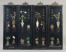 FOUR CHINESE CARVED HARDSTONE OVERLAID LACQUER PANELS, each carved with various hardstones including