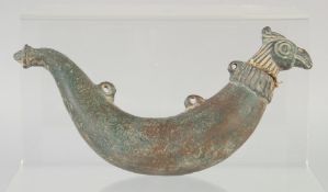 AN 18TH CENTURY MUGHAL INDIAN BRONZE POWDER FLASK, the lid in the form of a bird head, 20cm long.