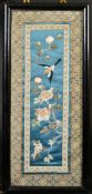 A CHINESE TEXTILE PANEL, framed and glazed, textile 58.5cm x 23.5cm.