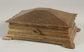 A FINE ISLAMIC GOLD INLAID STEEL CASKET, with hinged lid and key, 22cm x 15cm at base.