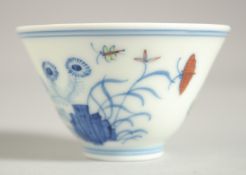 A CHINESE MING STYLE DOUCAI CUP, 7cm diameter.