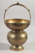 AN ENGRAVED BRASS SPITTOON, 29cm high.