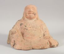 A TERRACOTTA SEATED BUDDHA, 25cm wide.