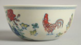 A CHINESE DOUCAI PORCELAIN CHICKEN CUP, 8.5cm diameter.