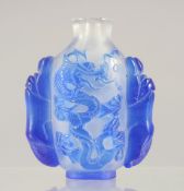 A CHINESE GLASS DRAGON SNUFF BOTTLE, 6.5cm.