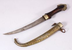 A GOOD ISLAMIC MOROCCAN DAGGER, with a carved gilt metal sheath, and carved wood handle, 40cm
