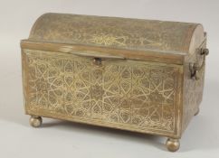 AN ENGRAVED BRASS LIDDED CASKET, with twin handles and raised on four ball feet, 29cm wide.
