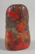 A CHINESE RED SOAP STONE BOULDER SEAL. 3.75ins high.