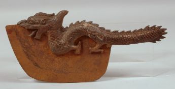 A TIBETAN BRONZE DRAGON AXE. 13ins long.