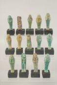 A COLLECTION OF FOURTEEN REPRODUCTION EGYPTIAN SHABTI'S, in a presentation box, (14).