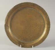 AN ENGRAVED FLORAL BRASS DISH, 30cm diameter.