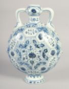 A CHINESE BLUE AND WHITE PORCELAIN TWIN HANDLE MOON FLASK, with floral motifs, 28cm high.