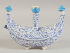 AN OTTOMAN IZNIK GLAZED POTTERY WATER FLASK, 21cm long.